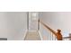 Hallway featuring wood railing and carpet flooring with a view of the bedroom at 52 Olivia Ct, Palmetto, GA 30268