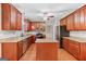 Spacious kitchen has an island, granite countertops and stainless steel appliances at 52 Olivia Ct, Palmetto, GA 30268
