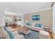Living room with seating area, hardwood floors, and view of dining room at 52 Olivia Ct, Palmetto, GA 30268
