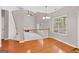 Open floor plan with fireplace and hardwood flooring at 52 Olivia Ct, Palmetto, GA 30268