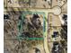 Property lines outlining a plot with a house and wooded area on a map at 52 Olivia Ct, Palmetto, GA 30268