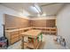 Functional workshop area with pegboards, built-in work surfaces, and convenient lighting at 52 Olivia Ct, Palmetto, GA 30268