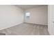 Bright bedroom with neutral walls, plush carpet flooring, and a window view at 280 Oliver Dr, Locust Grove, GA 30248