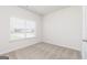 Well-lit bedroom with neutral walls, plush carpet flooring, and a window with blinds at 280 Oliver Dr, Locust Grove, GA 30248