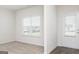 Inviting living space featuring a large window and an exterior door to outside at 280 Oliver Dr, Locust Grove, GA 30248