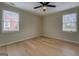 Empty bedroom featuring light-colored hardwood floors and neutral walls at 4131 Carroll Sw St, Covington, GA 30014