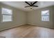 Bright bedroom with light wood flooring, neutral walls and a modern ceiling fan at 4131 Carroll Sw St, Covington, GA 30014
