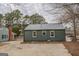 Exterior of home with an adjacent driveway and minimal landscaping at 4131 Carroll Sw St, Covington, GA 30014