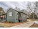 Exterior view of a cozy home with a covered porch and well-maintained yard at 4131 Carroll Sw St, Covington, GA 30014