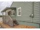 Charming home with a covered porch and steps leading to the entrance at 4131 Carroll Sw St, Covington, GA 30014