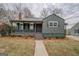 Charming home with a covered front porch, metal roof, and neatly landscaped front yard, offering great curb appeal at 4131 Carroll Sw St, Covington, GA 30014