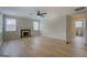 Spacious living room with a fireplace, light-colored hardwood floors, and plenty of natural light at 4131 Carroll Sw St, Covington, GA 30014
