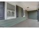 Covered porch with neutral paint, dark shutters, and an inviting space at 4131 Carroll Sw St, Covington, GA 30014