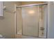 Bathroom shower with sliding glass doors and chrome fixtures at 4131 Carroll Sw St, Covington, GA 30014