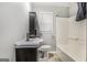 Cozy bathroom featuring a combination tub and shower unit at 734 Meadowlark Dr, Villa Rica, GA 30180