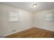 Clean bedroom featuring neutral walls, wood floors, and natural light at 734 Meadowlark Dr, Villa Rica, GA 30180