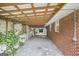 Covered carport featuring a wooden ceiling and access to the home, offering ample parking and protection from the elements at 734 Meadowlark Dr, Villa Rica, GA 30180