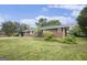 Exterior shot of a brick home with a well-manicured lawn and traditional architecture in a sunny setting at 734 Meadowlark Dr, Villa Rica, GA 30180