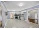Open concept kitchen with white cabinets, stainless steel appliances, and ceramic tile floors at 734 Meadowlark Dr, Villa Rica, GA 30180