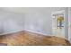 Spacious living room with hardwood floors, neutral walls, and a seamless transition to adjacent rooms at 734 Meadowlark Dr, Villa Rica, GA 30180