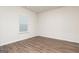 Cozy bedroom featuring luxury vinyl flooring, white walls and one window at 284 Oliver Dr, Locust Grove, GA 30248