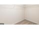 Walk-in closet with wire shelving and neutral carpet at 284 Oliver Dr, Locust Grove, GA 30248