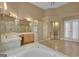 Bathroom featuring a soaking tub and a glass shower with tile floors and bright lighting at 111 Kenton Pl, Peachtree City, GA 30269