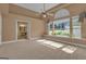 Bedroom with a large window, carpeted floors, and an attached bathroom at 111 Kenton Pl, Peachtree City, GA 30269