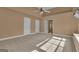 Bedroom featuring carpeted floors, a ceiling fan, and two entry doors at 111 Kenton Pl, Peachtree City, GA 30269