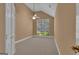 Neutral bedroom featuring vaulted ceilings, a ceiling fan, and a large window bringing in natural light at 111 Kenton Pl, Peachtree City, GA 30269