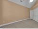 A bright bedroom with a ceiling fan, wall-to-wall neutral carpet and paneled closet doors at 111 Kenton Pl, Peachtree City, GA 30269