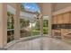 Eat-in dining area with light-filled windows overlooking the yard, tile flooring and a decorative chandelier at 111 Kenton Pl, Peachtree City, GA 30269