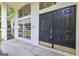 Inviting front entrance featuring a double door with sidelights and a covered porch at 111 Kenton Pl, Peachtree City, GA 30269