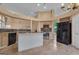 Spacious kitchen with a center island, stainless steel appliances, and adjacent eat-in area at 111 Kenton Pl, Peachtree City, GA 30269