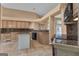 Kitchen features tile flooring, granite countertops, and dark appliances for a modern look at 111 Kenton Pl, Peachtree City, GA 30269