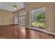 Light-filled living room showcasing hardwood floors and expansive windows with outdoor views at 111 Kenton Pl, Peachtree City, GA 30269