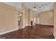 Open living area featuring a fireplace and hardwood floors, ideal for entertaining guests at 111 Kenton Pl, Peachtree City, GA 30269