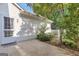 Enclosed patio with a tiled path and mature landscaping at 111 Kenton Pl, Peachtree City, GA 30269