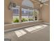 Room featuring carpeted floors, a ceiling fan, and bright natural light at 111 Kenton Pl, Peachtree City, GA 30269