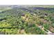 Aerial view of the property surrounded by lush greenery, showcasing its serene setting at 8129 S Giles Rd, Douglasville, GA 30135