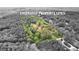 A captivating aerial view showcases a wooded property with defined boundary lines at 8129 S Giles Rd, Douglasville, GA 30135