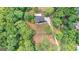 Aerial view of a home surrounded by a dense forest at 8129 S Giles Rd, Douglasville, GA 30135