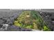A captivating aerial view showcases a wooded property with defined boundary lines at 8129 S Giles Rd, Douglasville, GA 30135
