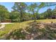 A spacious backyard with a wood pergola on a new concrete patio, perfect for outdoor activities at 8129 S Giles Rd, Douglasville, GA 30135