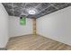 Basement with a window and wood-look flooring at 8129 S Giles Rd, Douglasville, GA 30135