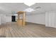 Spacious basement area featuring a bar, fireplace, and wood-look flooring at 8129 S Giles Rd, Douglasville, GA 30135