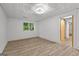 Basement featuring wood-look flooring and a window at 8129 S Giles Rd, Douglasville, GA 30135