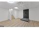 Finished basement area with a fireplace, modern floors, and staircase access at 8129 S Giles Rd, Douglasville, GA 30135