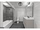 Bathroom featuring modern vanity, fixtures, and tile shower at 8129 S Giles Rd, Douglasville, GA 30135