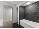 Bathroom featuring a tiled shower and soaking tub at 8129 S Giles Rd, Douglasville, GA 30135